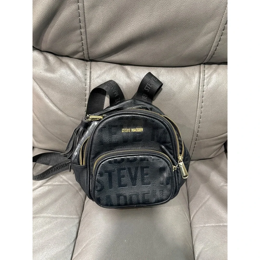Steve Madden Black Embossed Logo Mini Backpack‎ Convertible Strap Tassel Detail